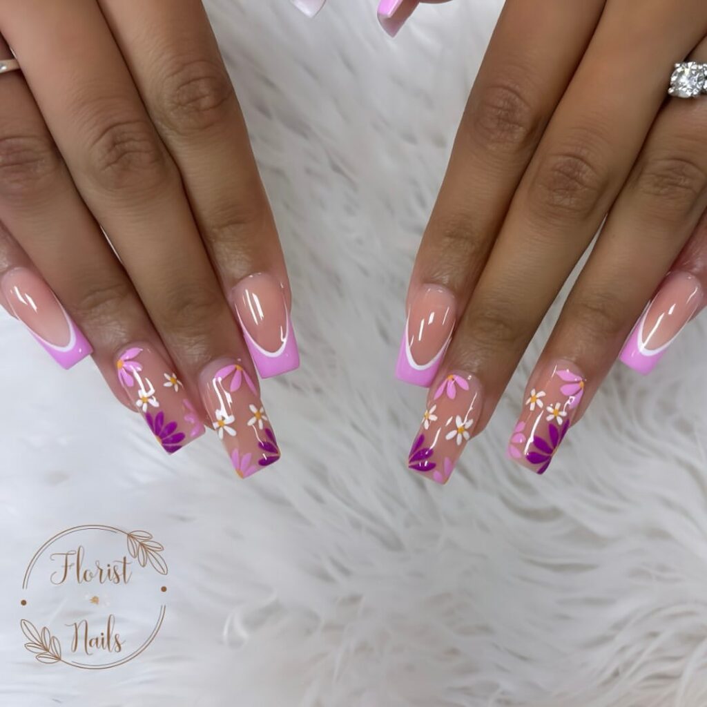 hands with nails that have floral designs