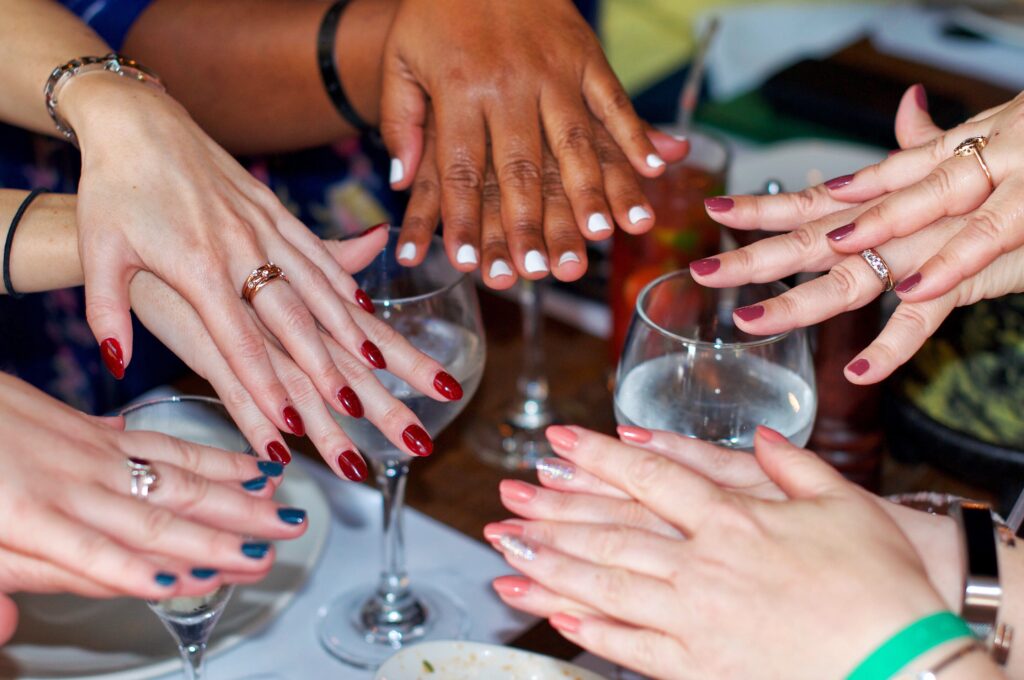 female hands showing off polished fingers